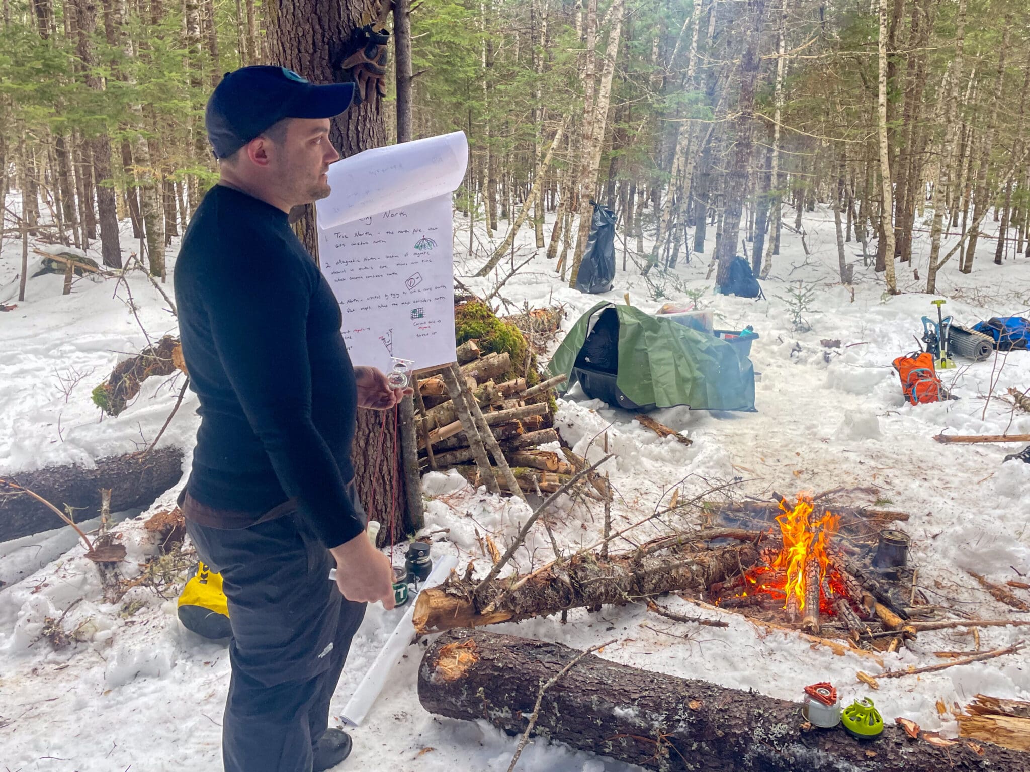 Flight paramedic Jeff Hammersmith instructs participants on the basic techniques of land navigation.
