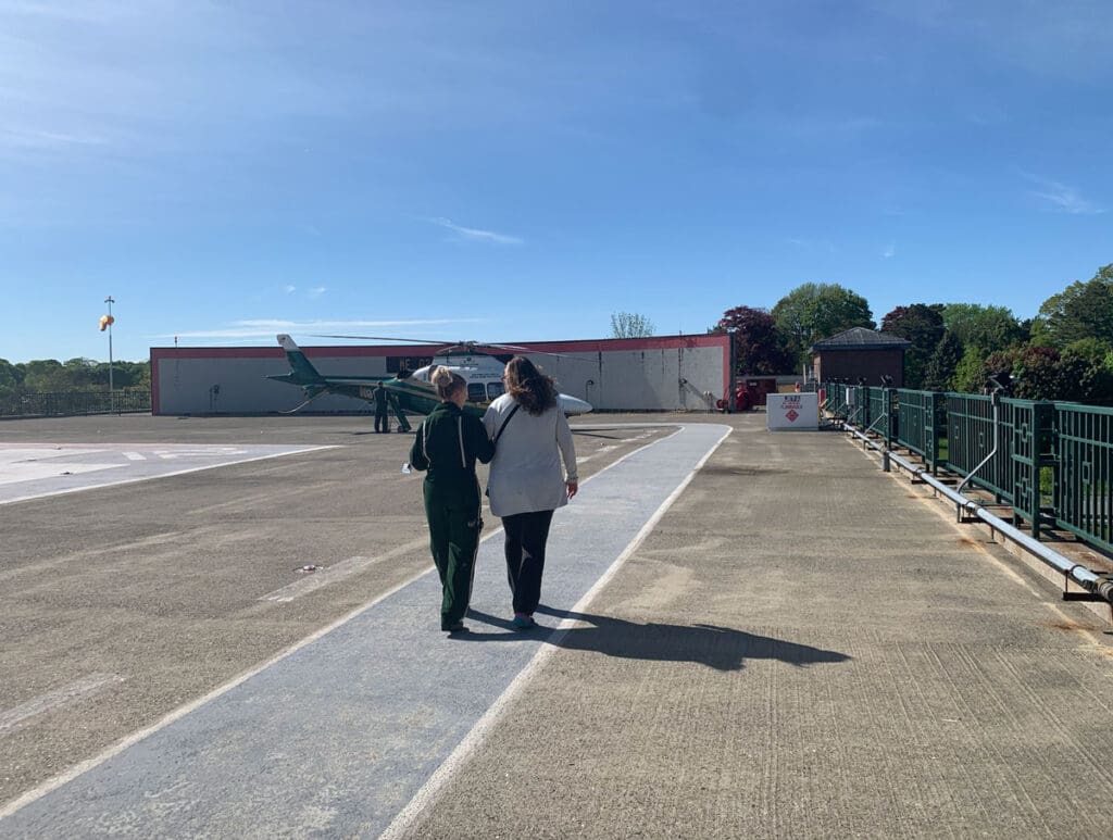 Missy McCann and Jenn Popper, backs to the camera, walk together