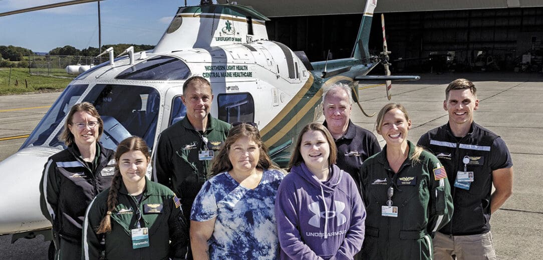Back row, left to right: Madeline Dougherty, pilot/captain; Steve Leavins, flight paramedic; Thomas Judge, executive director; Brad Alleger, flight paramedic. Front row: Charlotte Duncan, paramedic; Megan Day; Kyra Day; Denise Saucier, flight nurse.