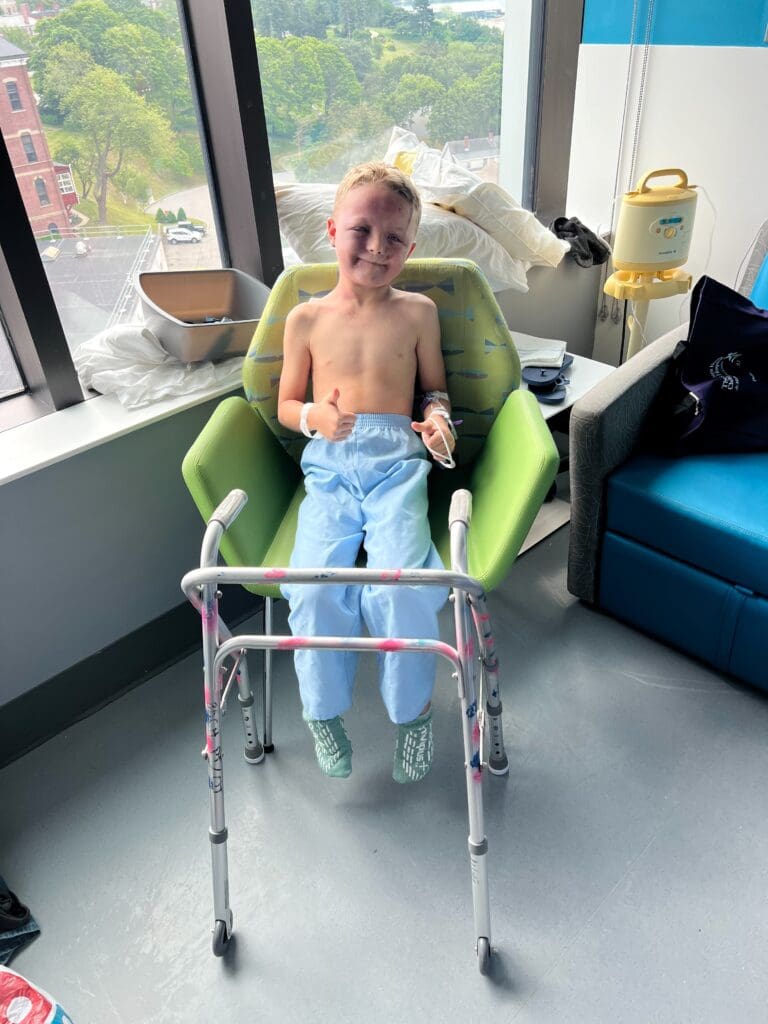 Connor with walker recovering from multiple fractures