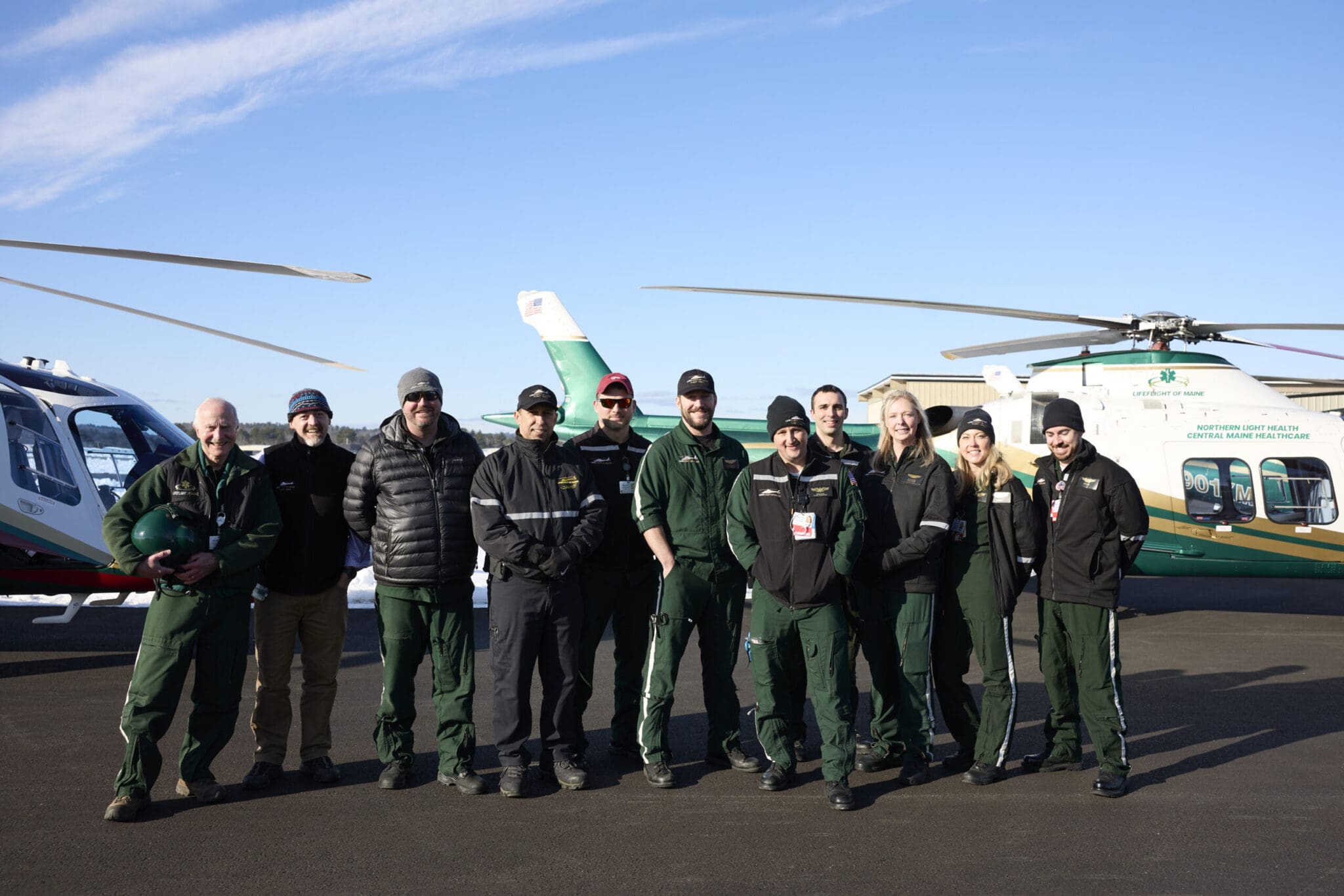 LifeFlight crew standing in front of helicopters