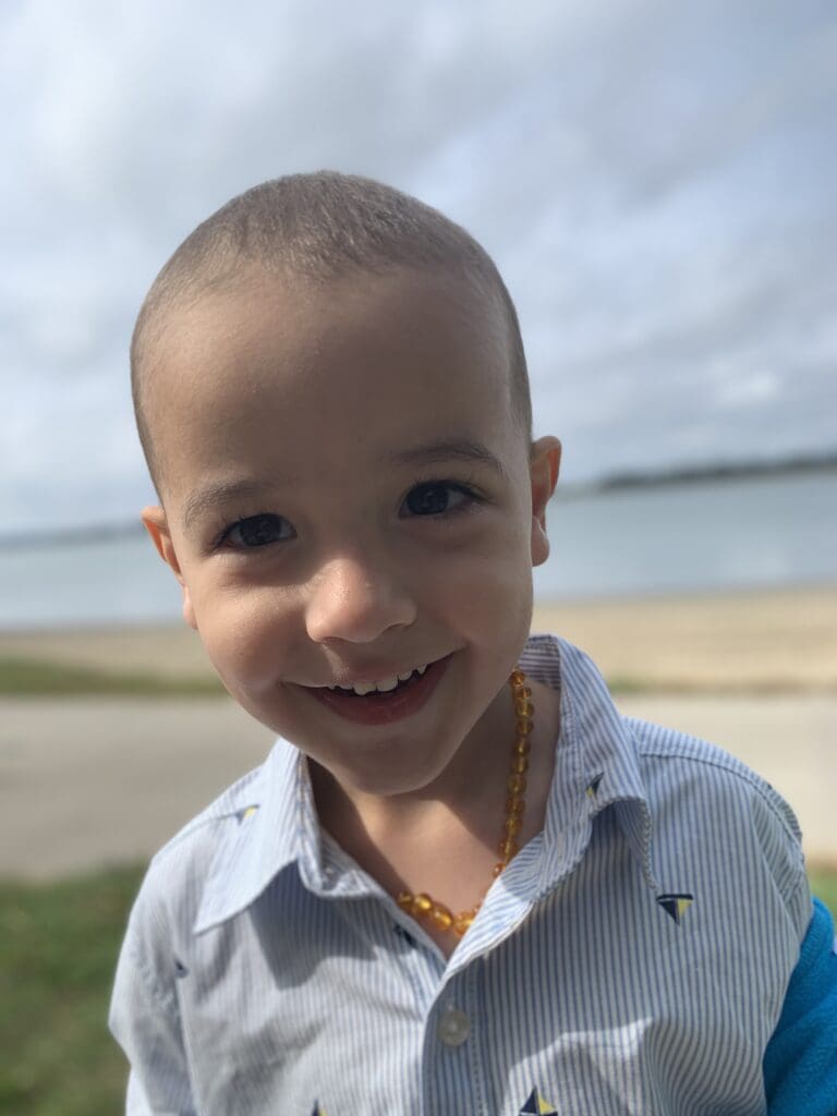 three-year-old Brian Dolan smiles for the camera
