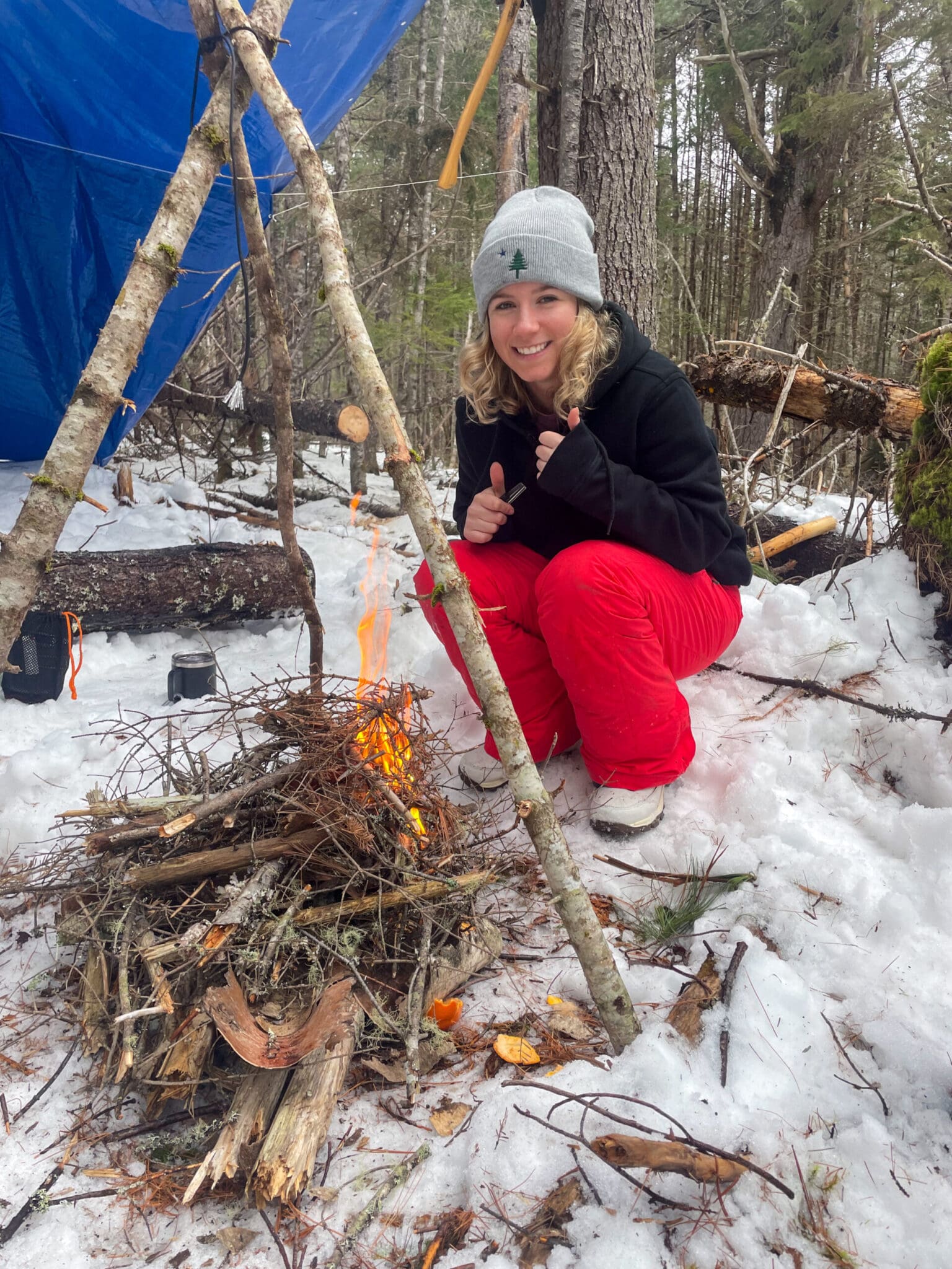 Flight nurse Lexi Beaulieu builds a fire.