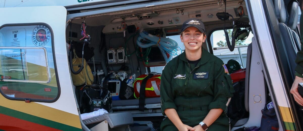 Flight Nurse Melissa Dufault by a LifeFlight helicopter.