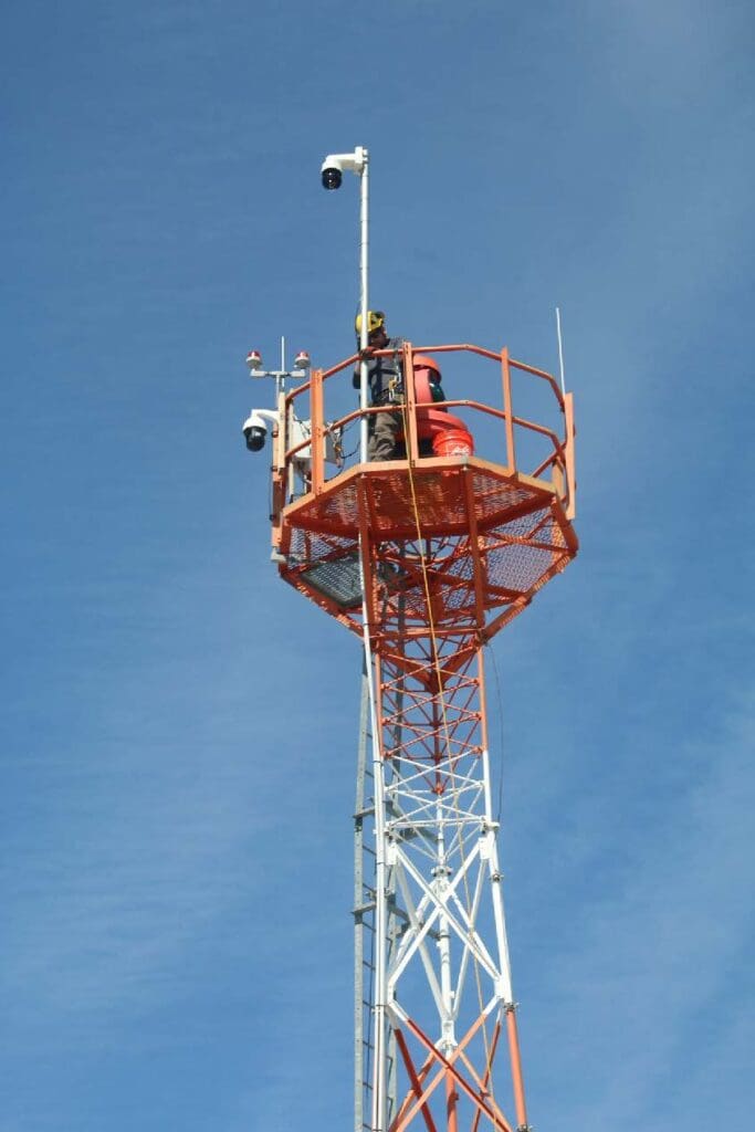 Infrastructure engineer John Rolfson installing a weather camera in Rangeley in 2023.