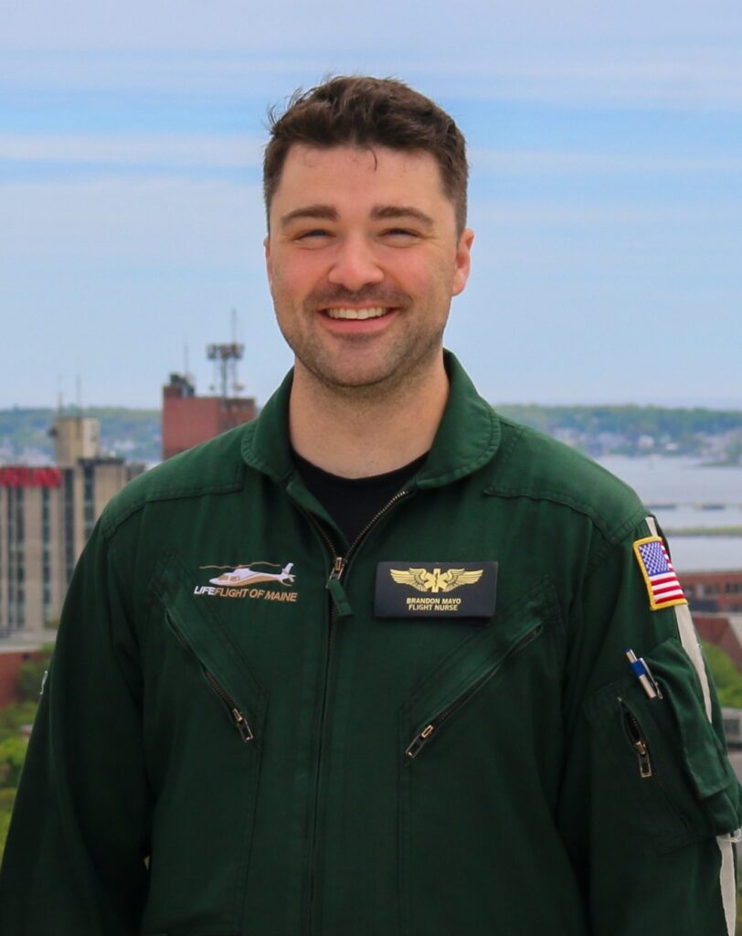 Brandon Mayo standing on top of a helipad.